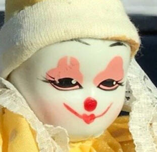 small but knowing clown doll